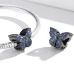 Strieborné kúzlo, tmavomodrý motýľ