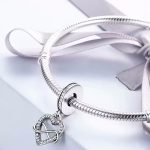 Ezüst charm, szív a végtelen jelével