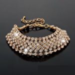 Pozlátený náramok s kryštálmi zlatej farby 17+6 cm