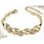 Náramok s listami, zdobený kryštálmi, v zlatej farbe