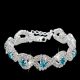 Kryštalický, geometrický náramok s modrými kamienkami, striebornej farby