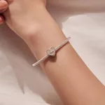 Ezüst charm, szív kereszttel