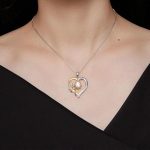 Ezüst női nyaklánc virágos szívmedállal