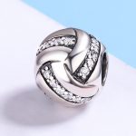 Ezüst charm, csomó