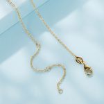 Ezüst nyaklánc életfamedállal, aranyszínű